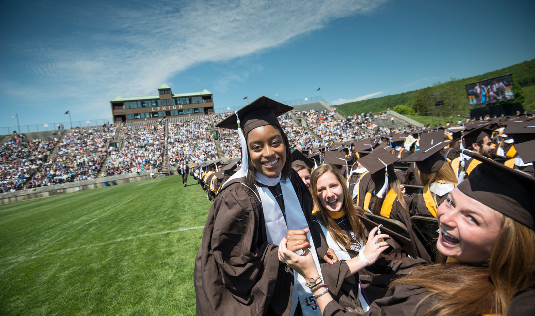 Female Lehigh students celebrating at commencement